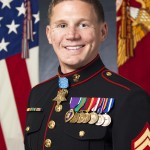 Retired U.S. Marine Corps Cpl. William Kyle Carpenter poses for his official Medal of Honor photo inside the Sheraton hotel, Arlington, Va., June 18, 2014. Cpl. Carpenter will receive the Medal for his actions while serving in Afghanistan.(U.S. Marine Corps photo by Cpl. Michael C. Guinto/Released)